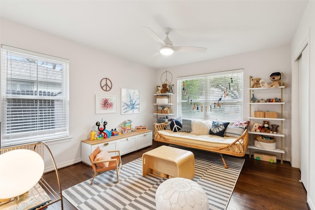 sitting room featuring hardwood / wood-style flooring and ceiling fan