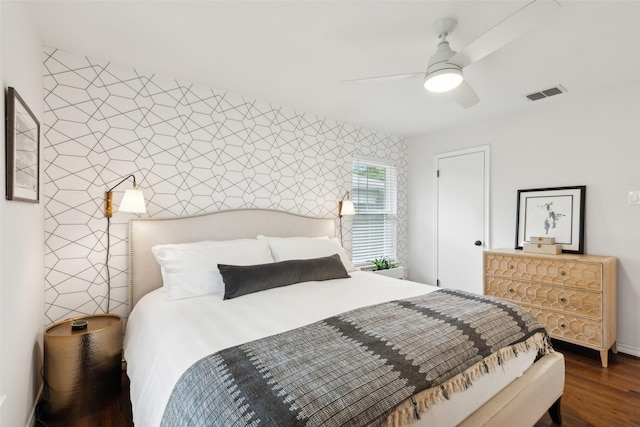 bedroom featuring dark hardwood / wood-style floors and ceiling fan