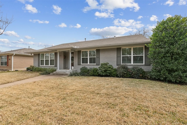 ranch-style home with a front lawn