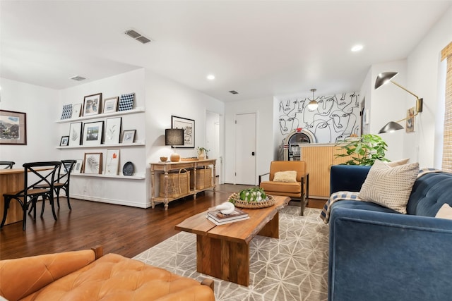 living room with dark hardwood / wood-style flooring