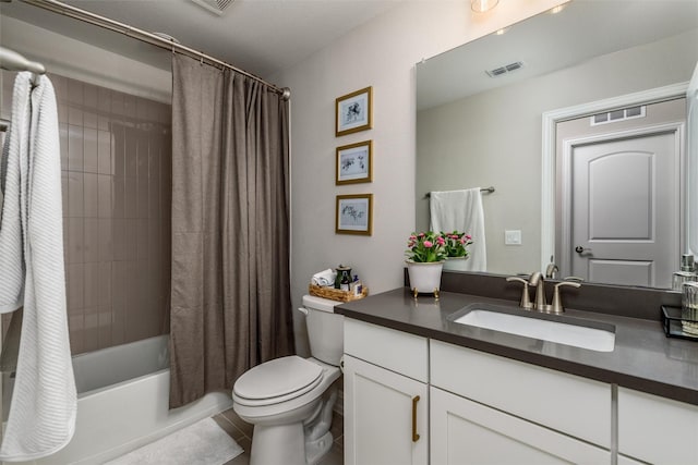 full bathroom featuring tile patterned floors, vanity, toilet, and shower / bath combo