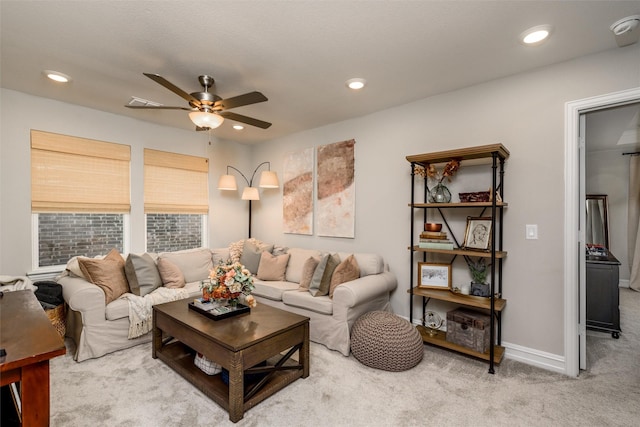 living room featuring carpet floors and ceiling fan