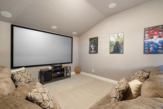 home theater with light carpet, vaulted ceiling, and baseboards