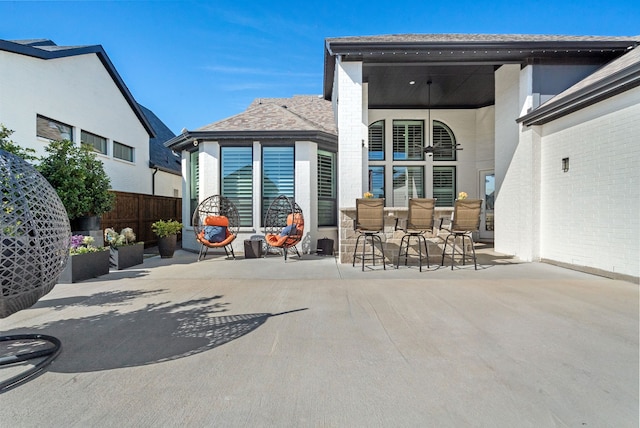 back of house with a patio area and fence