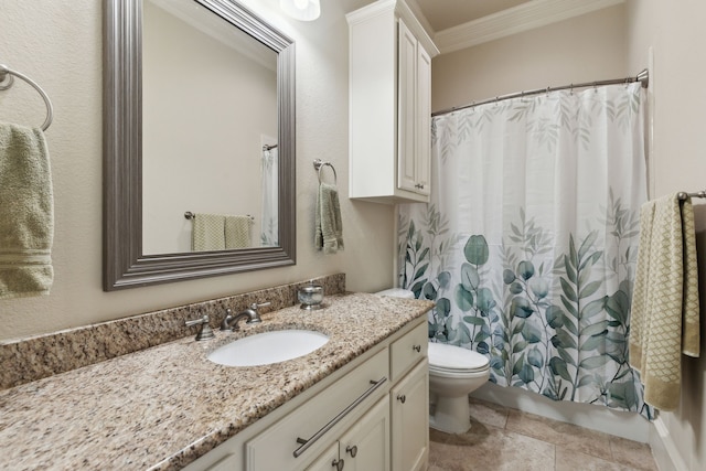 bathroom featuring vanity, crown molding, tile patterned floors, and toilet