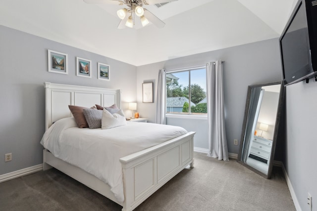 carpeted bedroom featuring lofted ceiling and ceiling fan