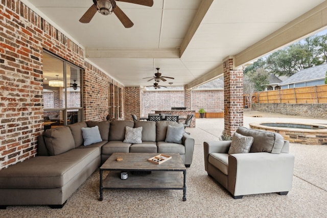 view of patio / terrace with an outdoor hangout area, ceiling fan, and an in ground hot tub