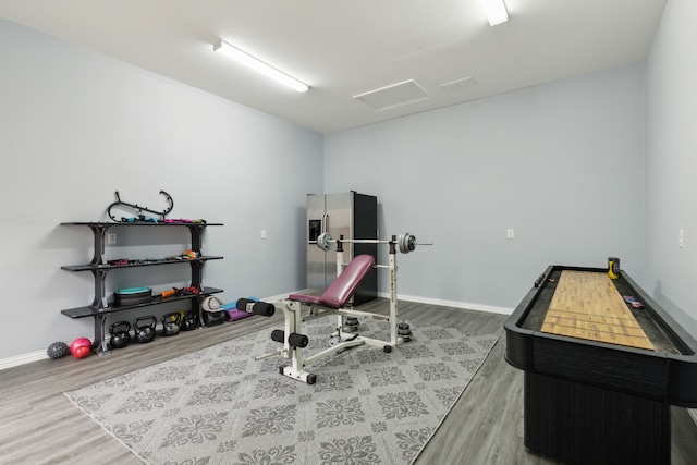 exercise room featuring hardwood / wood-style flooring