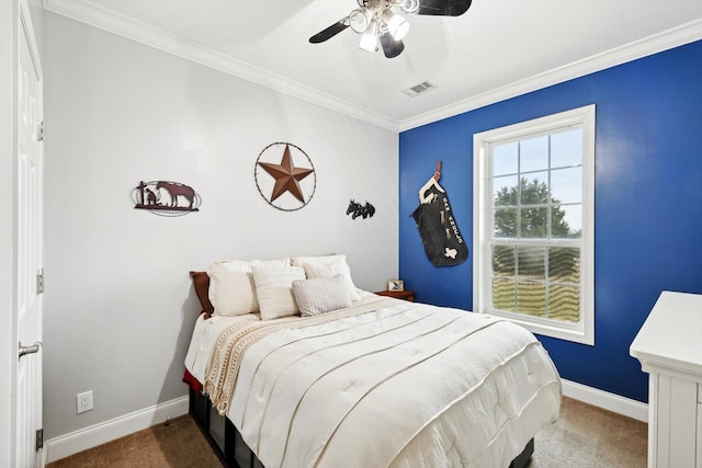 bedroom with ornamental molding, carpet, and ceiling fan