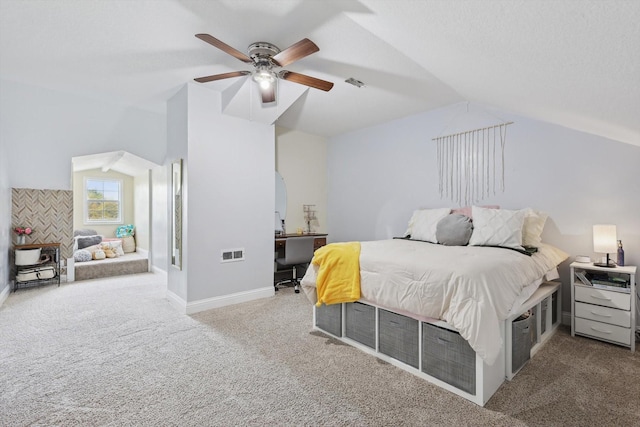 carpeted bedroom featuring ceiling fan and vaulted ceiling