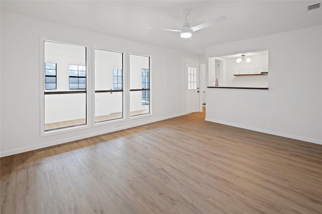 spare room featuring ceiling fan and wood-type flooring