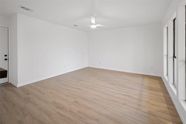 unfurnished room featuring ceiling fan and light hardwood / wood-style floors