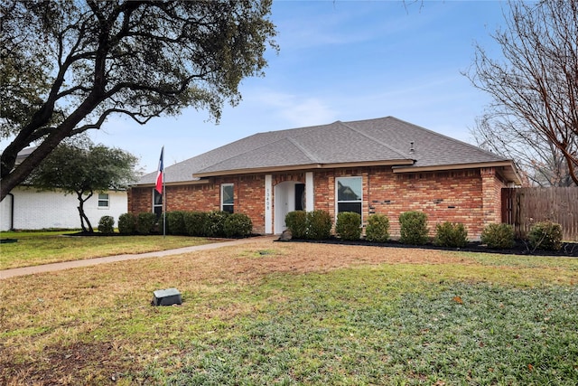 ranch-style home with a front yard