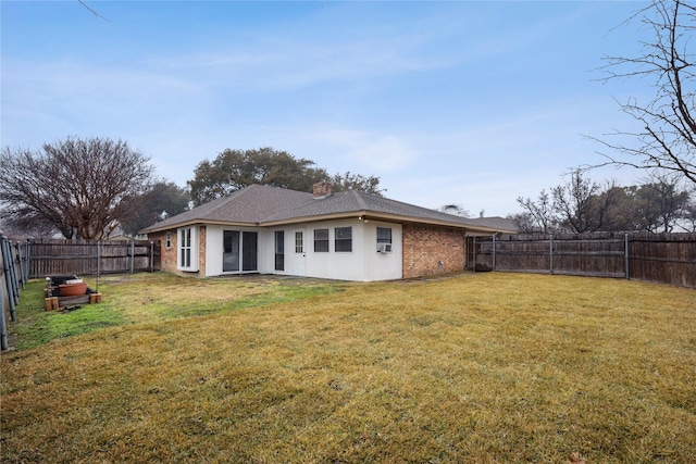 back of house featuring a yard