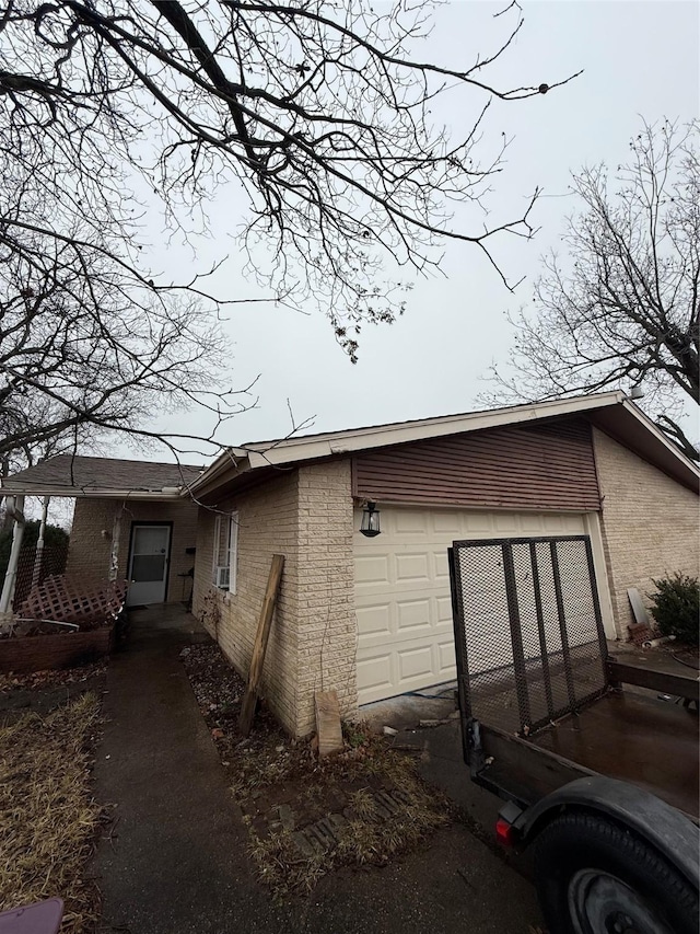 view of side of property featuring a garage