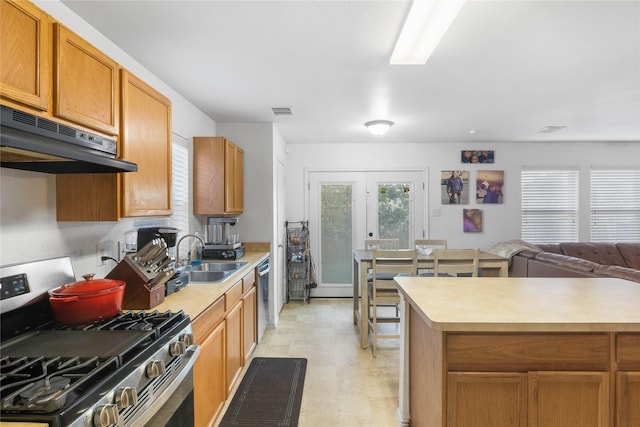 kitchen with appliances with stainless steel finishes, sink, and french doors