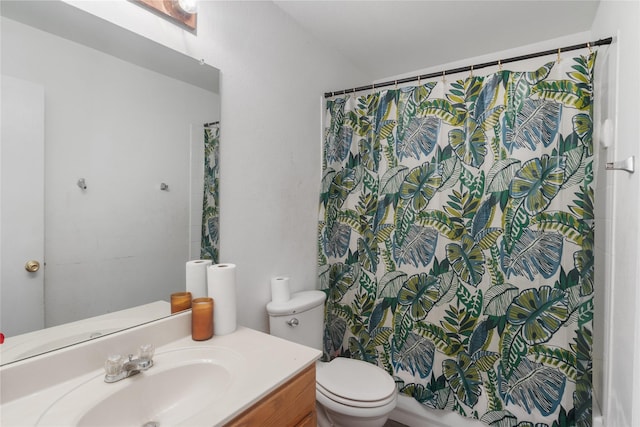 bathroom with vanity, a shower with shower curtain, and toilet