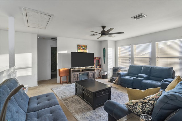 living room with light colored carpet and ceiling fan