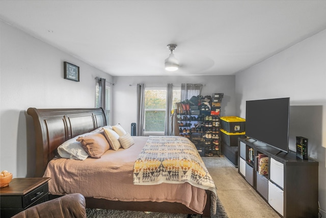 bedroom with light colored carpet and ceiling fan