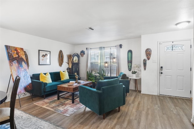 living room with light hardwood / wood-style flooring