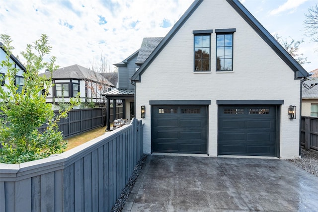 view of side of property featuring a garage