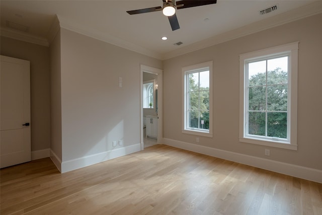 unfurnished room with crown molding, ceiling fan, and light hardwood / wood-style floors