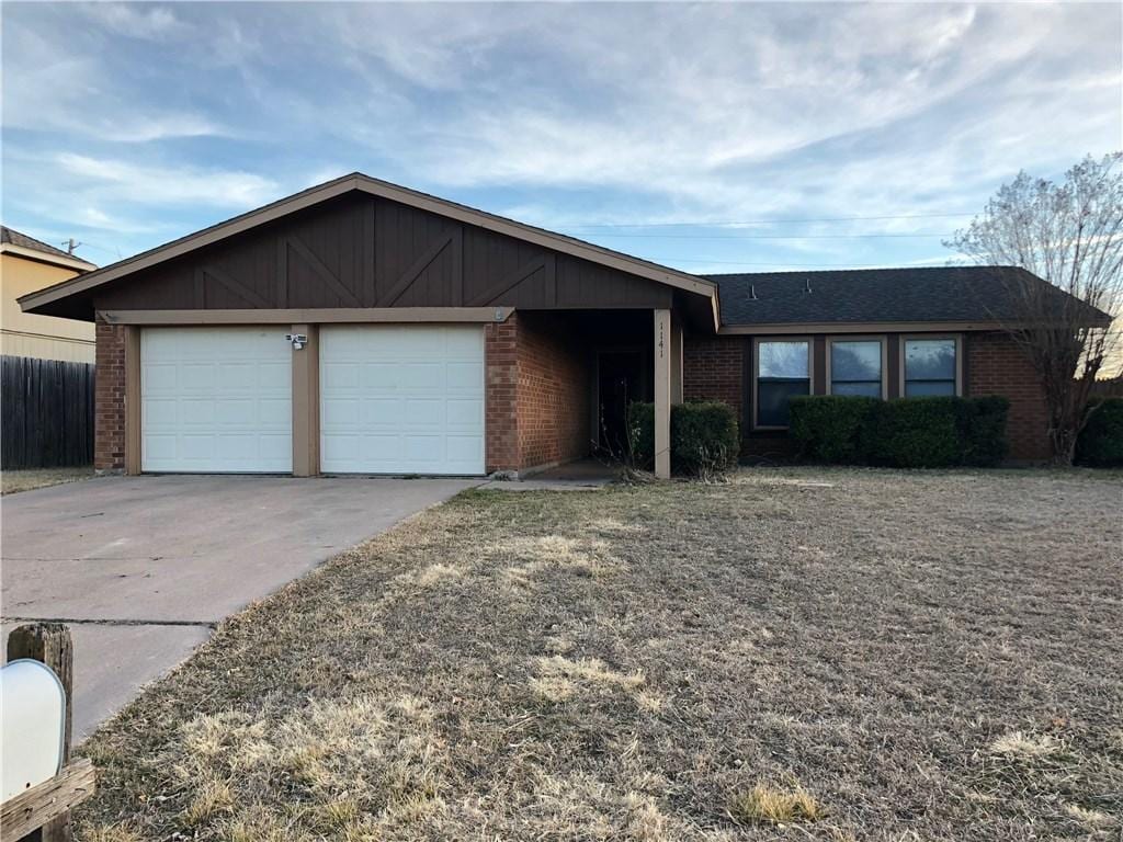 ranch-style home featuring a garage