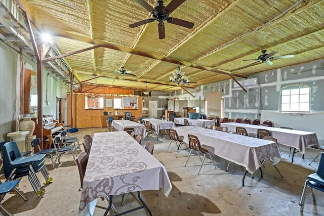 dining area featuring concrete flooring and ceiling fan