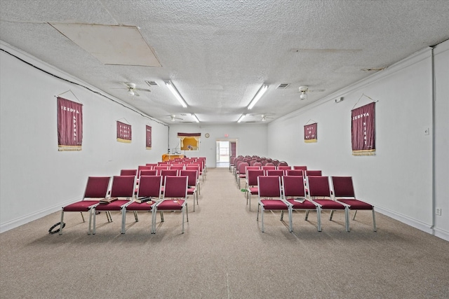 home theater featuring carpet floors and a textured ceiling