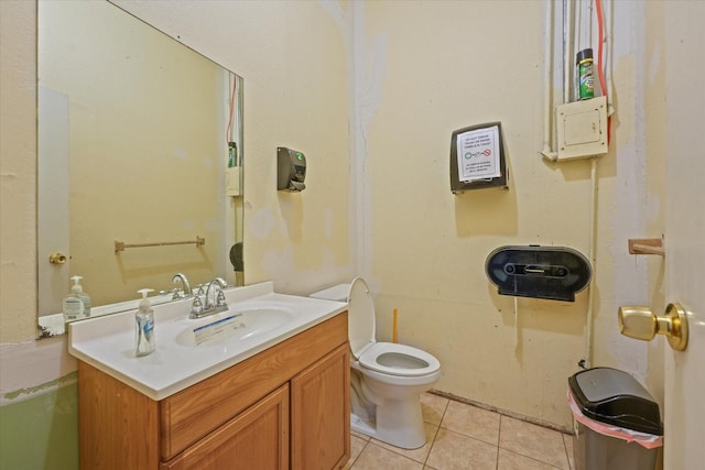 bathroom featuring vanity, tile patterned floors, and toilet