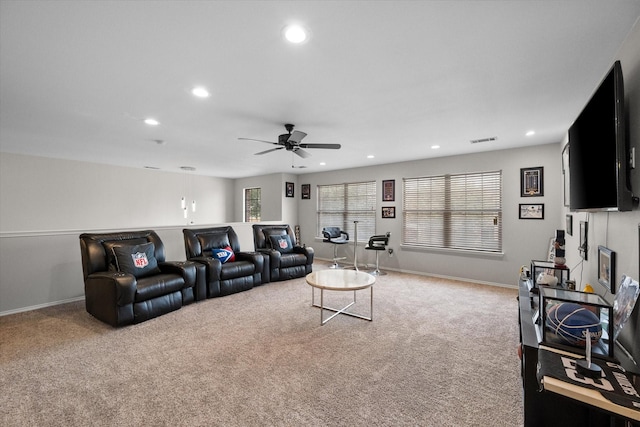 carpeted living room with a healthy amount of sunlight and ceiling fan