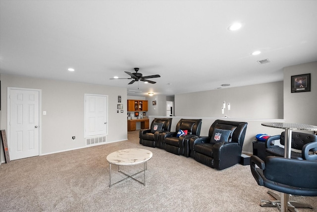 living room with light carpet and ceiling fan