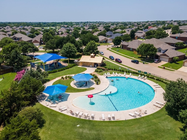 view of swimming pool featuring a patio area and a lawn