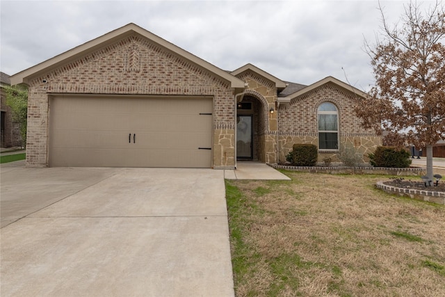 ranch-style home with a garage and a front yard