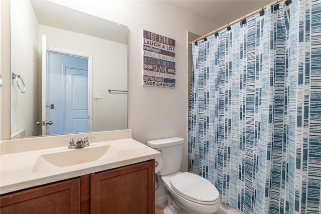 bathroom with vanity, walk in shower, and toilet