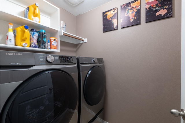 clothes washing area featuring independent washer and dryer