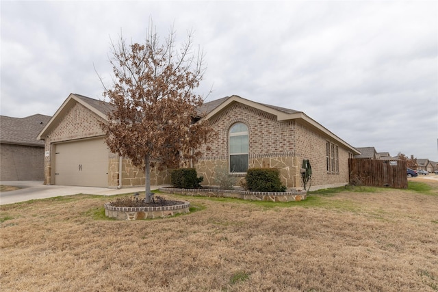 view of front of house with a garage and a front yard