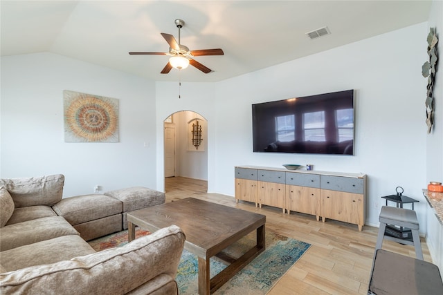 living room with lofted ceiling, light hardwood / wood-style flooring, and ceiling fan