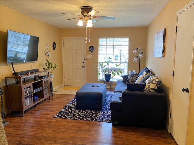 living room with hardwood / wood-style floors and ceiling fan