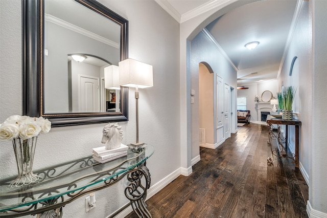 hall featuring crown molding and dark wood-type flooring