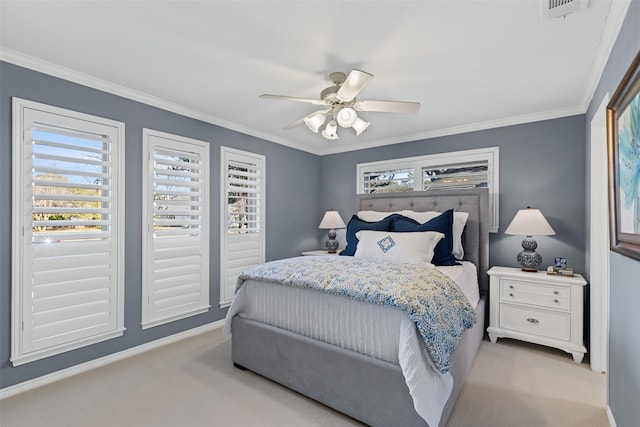 carpeted bedroom featuring crown molding and ceiling fan