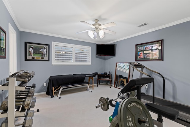 exercise area with crown molding, ceiling fan, and light carpet