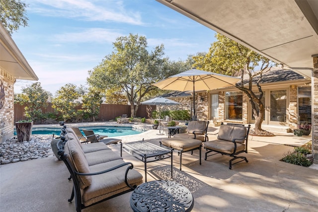 view of patio featuring a fenced in pool