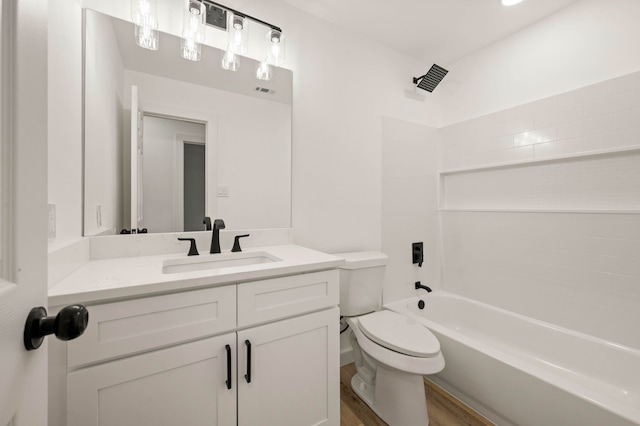 full bathroom with shower / bath combination, vanity, wood-type flooring, and toilet