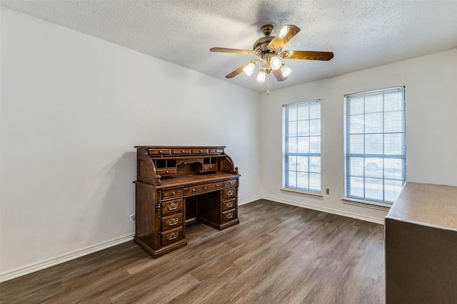 office space featuring ceiling fan, hardwood / wood-style flooring, and a textured ceiling