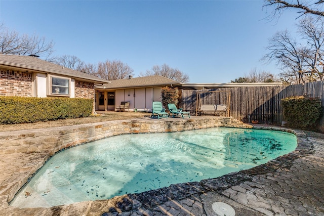 view of swimming pool featuring a patio