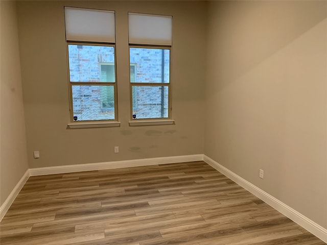 spare room with light hardwood / wood-style floors