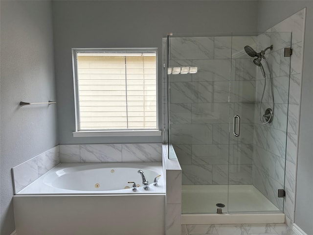 full bath featuring a whirlpool tub and a stall shower