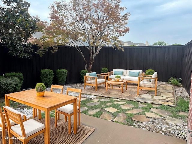 view of patio with outdoor lounge area and a fenced backyard