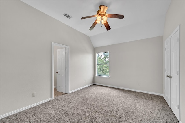 unfurnished bedroom with lofted ceiling, light colored carpet, and ceiling fan